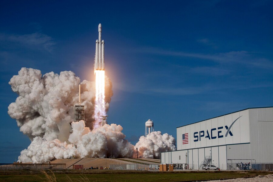 The image is sourced from Unsplash: https://unsplash.com/photos/rocket-ship-launching-during-daytime-Ptd-iTdrCJM